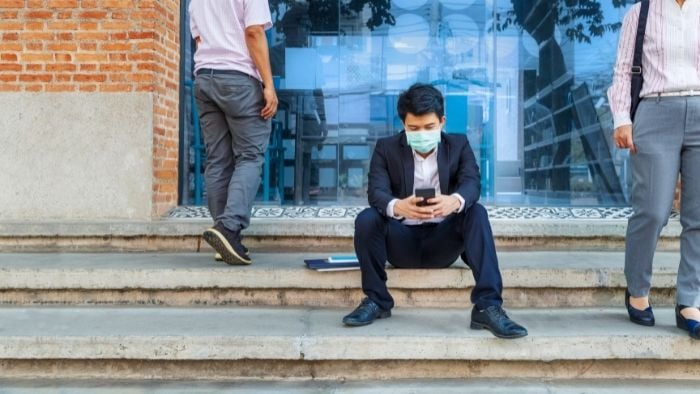 man sitting on street